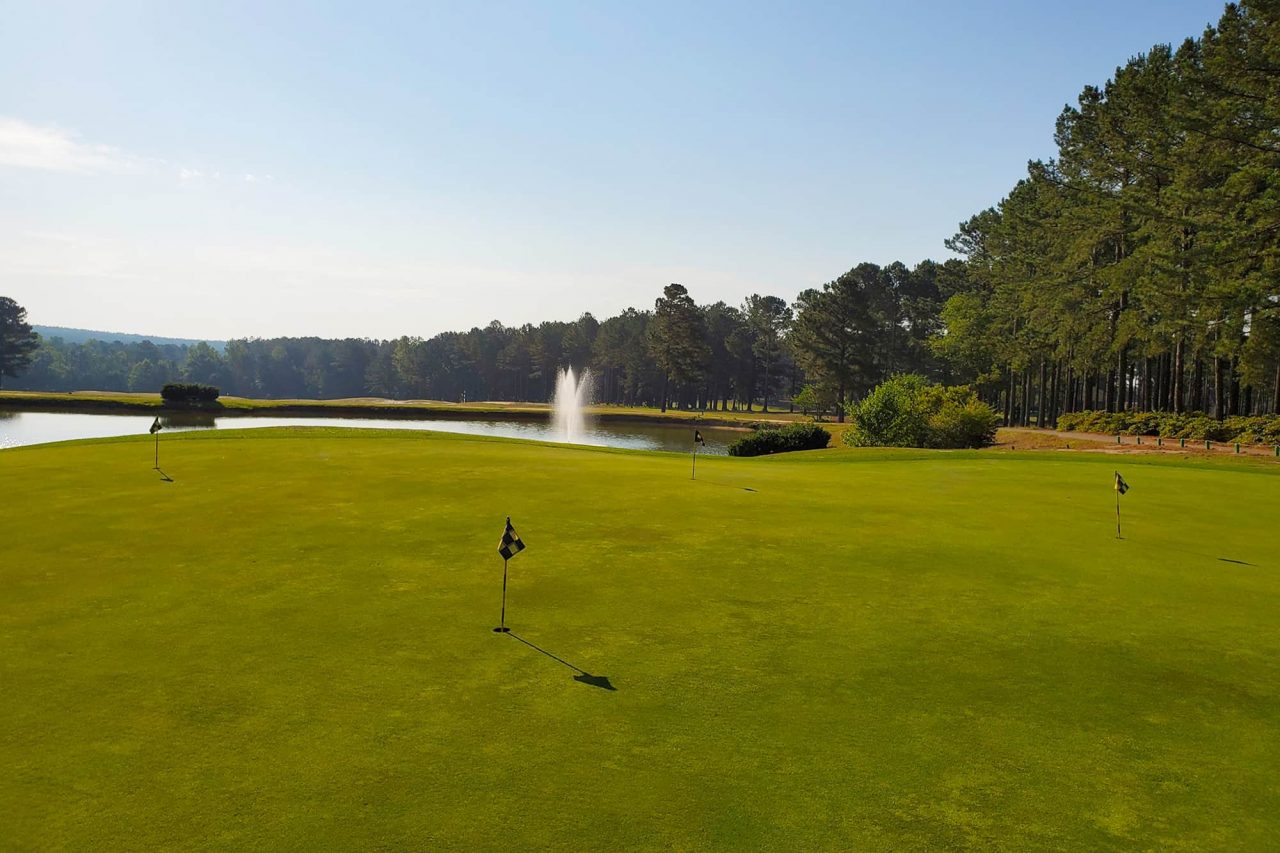 Course greens with a fountain in the background 